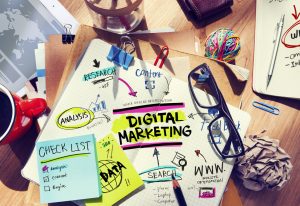 Office Desk with Tools and Notes About Digital Marketing